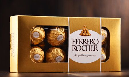 POZNAN, POLAND - DEC 7, 2017: Ferrero Rocher premium chocolate sweets produced by the Italian chocolatier Ferrero SpA., sold in over 40 countries in amount of about 3.6 billion a yearのeditorial素材