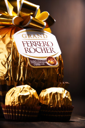 POZNAN, POLAND - DEC 7, 2017: Ferrero Rocher premium chocolate sweets produced by the Italian chocolatier Ferrero SpA., sold in over 40 countries in amount of about 3.6 billion a yearのeditorial素材