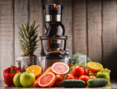 Slow juicer with organic fruits and vegetables. Detox dietの写真素材