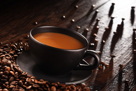 Composition with cup of coffee and beans.の写真素材