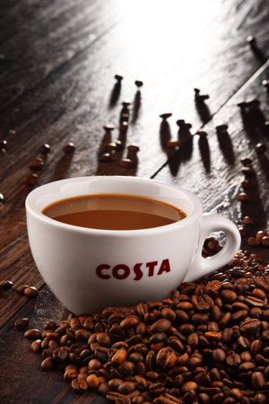 POZNAN, POLAND - MAR 7, 2018: Cup of Costa Coffee, a brand of British multinational coffeehouse company headquartered in Dunstable, Bedfordshire; second largest coffeehouse chain in the worldのeditorial素材