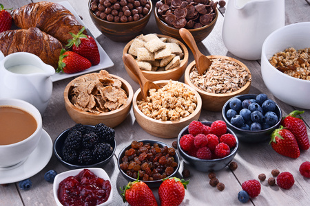 Composition with different sorts of breakfast cereal products and fresh fruits.の写真素材
