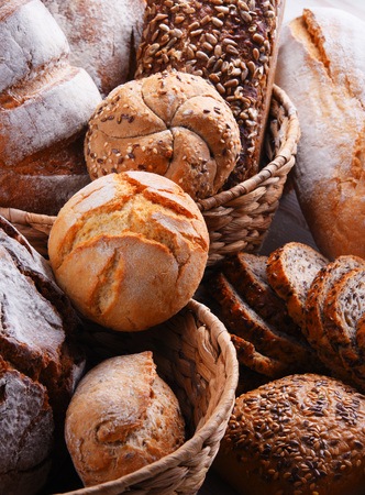 Composition with assorted bakery products in wicker basketの写真素材
