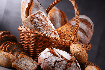 Composition with assorted bakery products in wicker basket