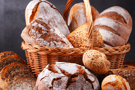 Composition with assorted bakery products in wicker basketの写真素材