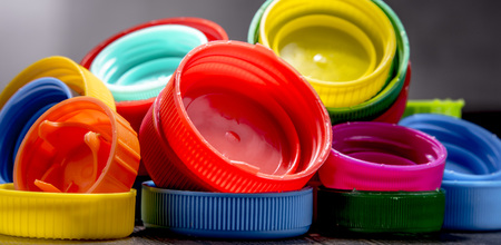 Composition with colorful plastic bottle caps. Recyclingの写真素材