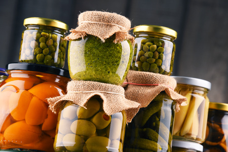 Jars with variety of pickled vegetables. Preserved foodの写真素材