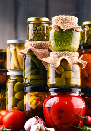 Jars with variety of pickled vegetables. Preserved foodの写真素材
