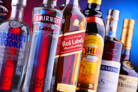 POZNAN, POLAND - NOV 16, 2018: Bottles of assorted global liquor brands including whiskey, vodka, cognac and liqueurのeditorial素材