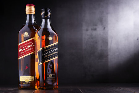 POZNAN, POL - NOV 15, 2018: Bottles of Johnnie Walker, the most widely distributed brand of blended Scotch whisky in the world with sales of over 130 million bottles a year.のeditorial素材