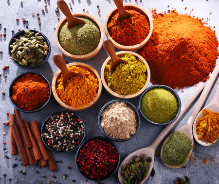 Variety of spices on kitchen table.の写真素材