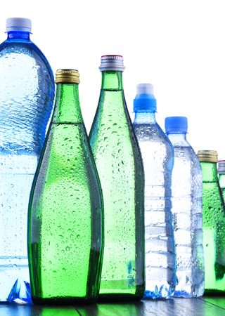 Composition with different sorts of bottles containing mineral water isolated on whiteの写真素材