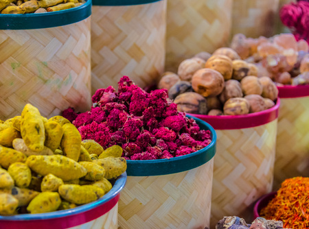 Variety of spices and herbs on the arab street market stall. Dubai Spice Souk, United Arab Emirates.