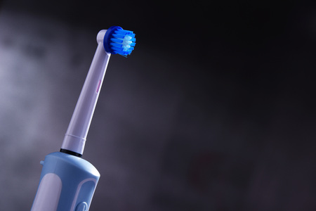 Modern electric toothbrush powered by rechargeable battery.の写真素材