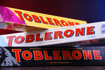 POZNAN, POL - MAR 22, 2019: Three bars of Toblerone, a Swiss chocolate brand owned by US confectionery company Mondelez International, Inc.のeditorial素材