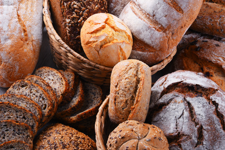 Composition with assorted bakery products in wicker basketの写真素材