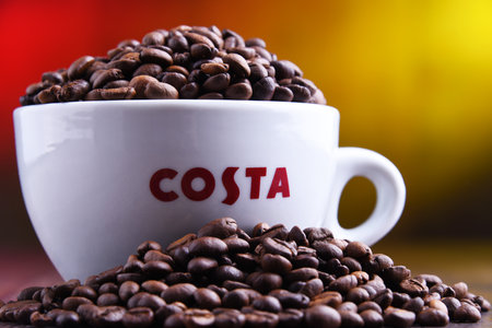 POZNAN, POL - MAR 29, 2019: Cup of Costa Coffee, a brand of British multinational coffeehouse company headquartered in Dunstable, Bedfordshire; second largest coffeehouse chain in the worldのeditorial素材
