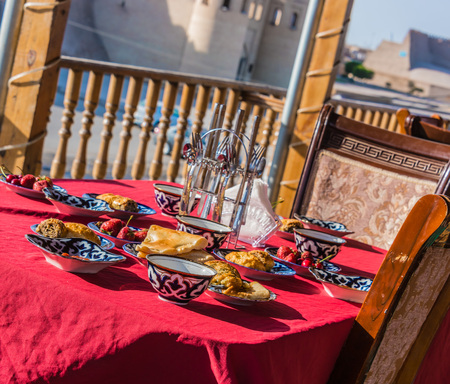 Traditional Uzbek breakfast served on the terrace.の写真素材