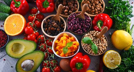 Composition with assorted organic food products on wooden kitchen tableの写真素材