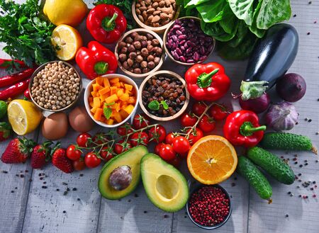 Composition with assorted organic food products on wooden kitchen tableの写真素材
