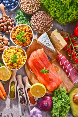 Composition with assorted food products on kitchen table.の写真素材