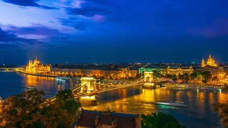 Panoramic view of Budapest with Hungarian Parliament Building on the bank of the Danube and Chain Bridge by nightの写真素材