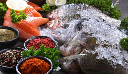 Different sorts of fish on kitchen table,の写真素材