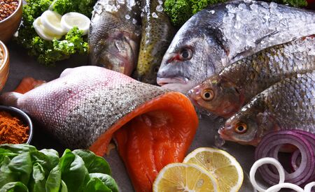 Different sorts of fish on kitchen table,の写真素材