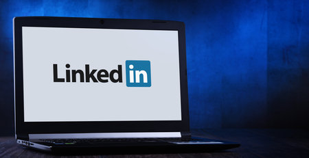 POZNAN, POL - NOV 14, 2019: Laptop computer displaying logo of LinkedIn, an American business and employment-oriented service that operates via websites and mobile appsのeditorial素材