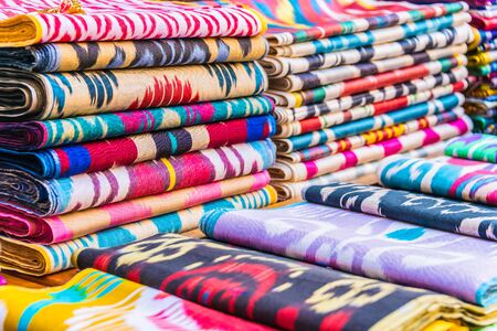Traditional Asian cloth sold in a store in the Historic Centre of Bukhara, Uzbekistan