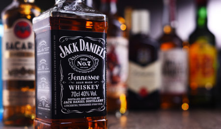 POZNAN, POLAND - DEC 20, 2019: Bottles of assorted global liquor brands including whiskey, vodka, gin and liqueurのeditorial素材