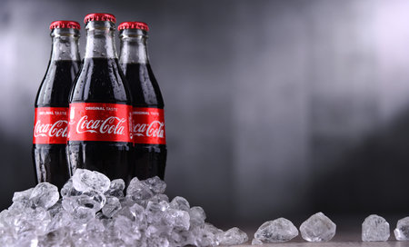 POZNAN, POL - DEC 27, 2019: Bottles of Coca-Cola, a carbonated soft drink manufactured by The...