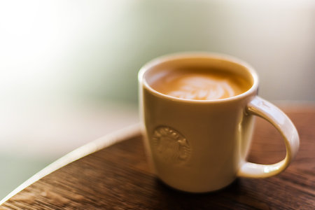 POZNAN, POL - DEC 11, 2019: Cup of Starbucks, the name of coffee company and coffeehouse chain, founded in Seattle, Wa. USA, in 1971; now the largest business of this kind in the world.のeditorial素材