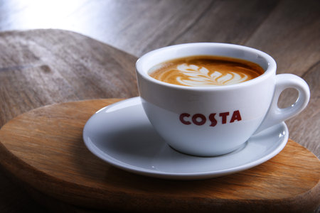 POZNAN, POL - DEC 13, 2019: Cup of Costa Coffee, a brand of British multinational coffeehouse company headquartered in Dunstable, Bedfordshire; second largest coffeehouse chain in the worldのeditorial素材