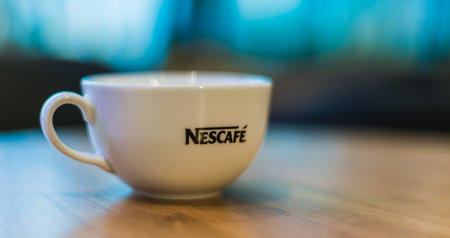 POZNAN, POLAND - DEC 11, 2019: Cup of Nescafe coffee, a brand of Swiss coffee made by Nestle and introduced in 1938のeditorial素材