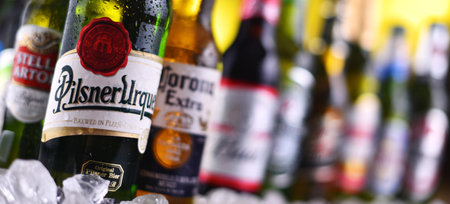 POZNAN, POL - DEC 23, 2019: Bottles of famous global beer brands including Heineken, Becks, Bud, Miller, Corona, Stella Artois, and Pilsner Urquellのeditorial素材