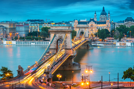 BUDAPEST, HUNGARY - JUL 31, 2019: Panoramic view of Budapest with Chain Bridge and St. Stephen's Basilica after sunsetのeditorial素材