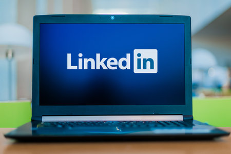 POZNAN, POL - DEC 11, 2019: Laptop computer displaying logo of LinkedIn, an American business and employment-oriented service that operates via websites and mobile appsのeditorial素材