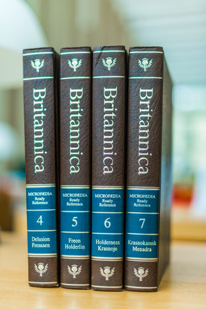 POZNAN, POL - FEB 03, 2020: Encyclopedia Britannica volumes in a public libraryのeditorial素材