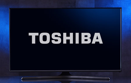 POZNAN, POL - FEB 04, 2020: Flat-screen TV set displaying logo of Toshiba, a Japanese multinational conglomerate headquartered in Tokyoのeditorial素材