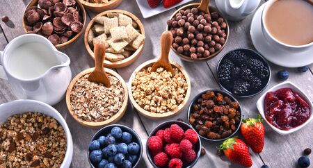 Composition with different sorts of breakfast cereal products and fresh fruits.の写真素材