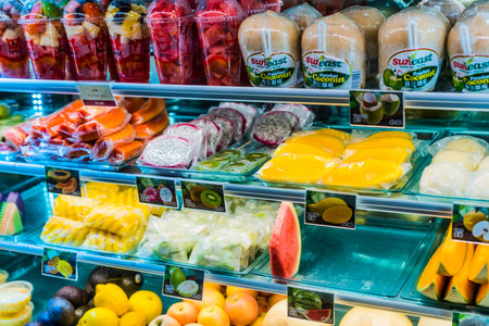 SINGAPORE - MAR 3, 2020: Packages with fresh fruits displayed in a commercial refrigeratorのeditorial素材