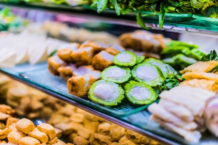 Traditional Asian dishes sold in a shopping mall food courtの写真素材