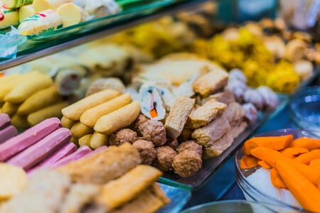 Traditional Asian dishes sold in a shopping mall food courtの写真素材