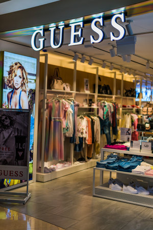 SINGAPORE - MAR 5, 2020: Front entrance to Guess store in Singapore shopping mallのeditorial素材