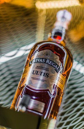 SINGAPORE - MAR 7, 2020: Bottle of Chivas Regal Ultis, a blended Scotch whisky produced by Chivas Brothers in Keith, Scotlandのeditorial素材