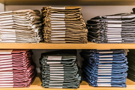 Clothing products on the shelf in a clothing store.