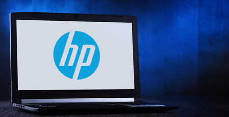POZNAN, POL - APR 3, 2020: Laptop computer displaying logo of HP, a multinational information technology company headquartered in Palo Alto, Californiaのeditorial素材