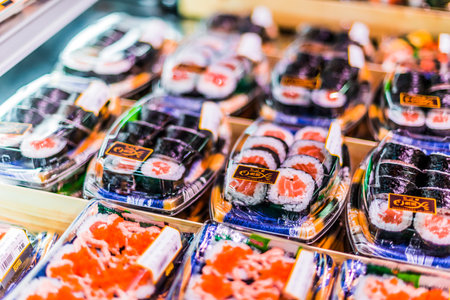 SINGAPORE - MAR 3, 2020: Prepackaged ready-to-eat sushi put up for sale in a commercial refrigeratorのeditorial素材