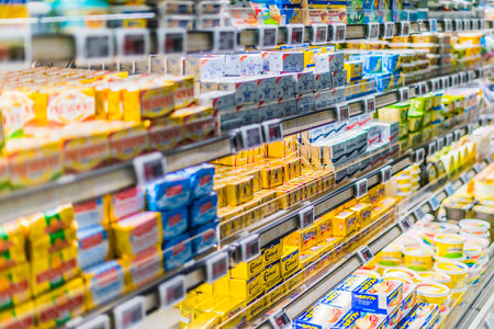 SINGAPORE - MAR 3, 2020: Variety of food products put up for sale in a commercial refrigeratorのeditorial素材